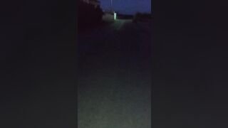 showing tits at dark street