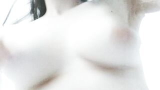 Bouncing my pale natural boobs from a funny angle.