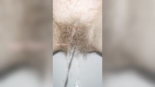 Sensual Slow Motion Piss by Mega Hairy Pussy Up Close
