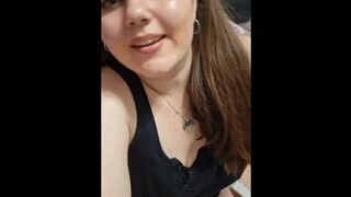 the girl smiles and shows her legs
