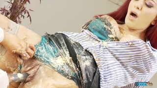 Nasty lesbians cover their bodies with food as they rub their clits and pound their cunts with dildo