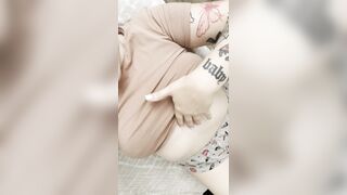 Charming brunette in a tight T-shirt seductively shows off her lush forms.