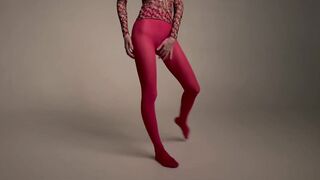 stretching long legs in red tights