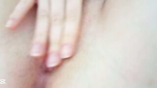 Petite moaning softly with her eyes closed